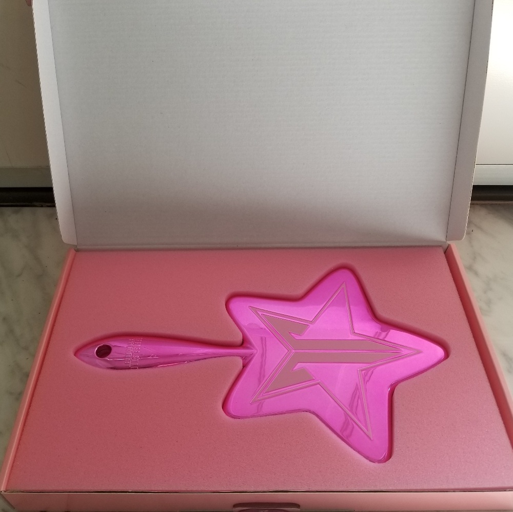 Jeffrey Star baby pink chrome mirror.